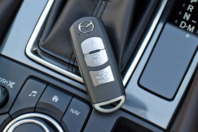 mazda car key on a car clutch