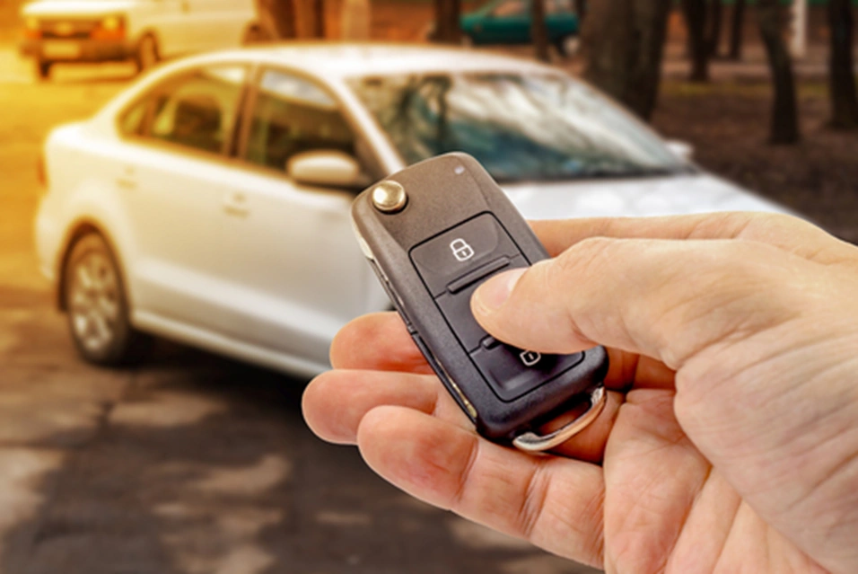 key fob held in front of a car