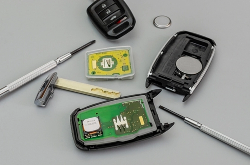 a disassembled car key fob