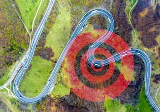 gps logo overlaps the picture of a road from above