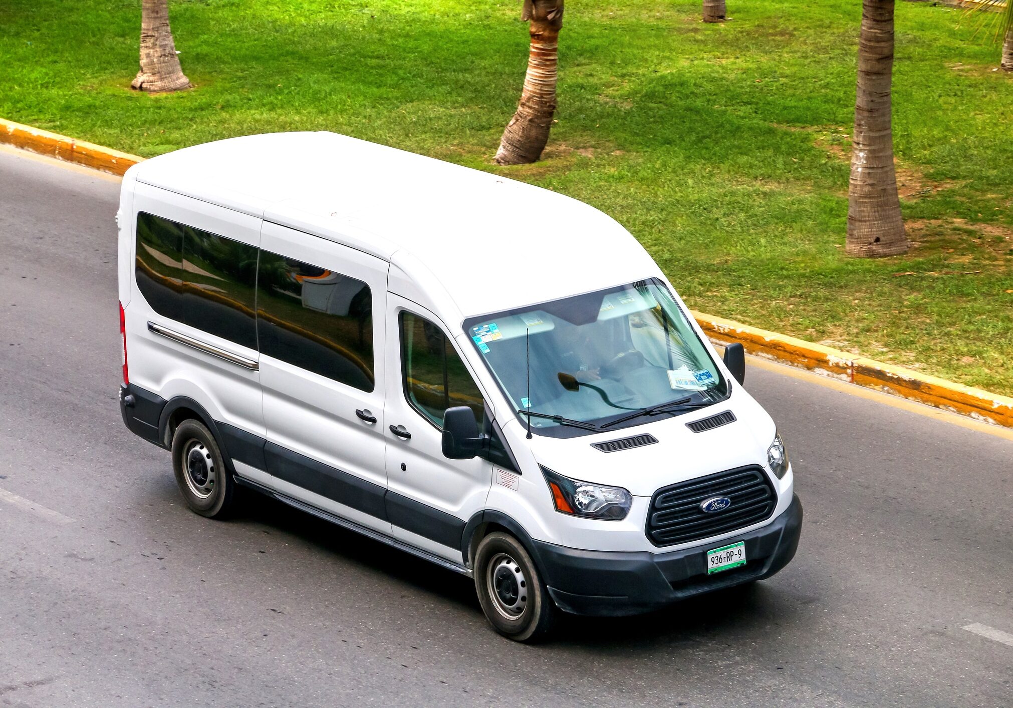 CANCUN, MEXICO - JUNE 3, 2017: White van Ford Transit in the city street.